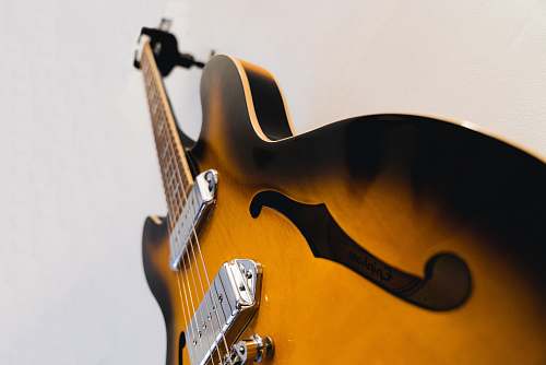 electric guitar worms-eye-view of brown electric guitar guitar